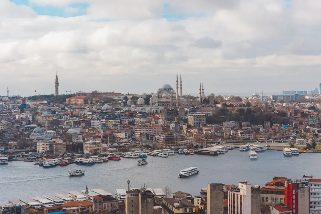 An expansive aerial perspective of the Bosphorus Strait in Istanbul showing the bridge and city skyline.