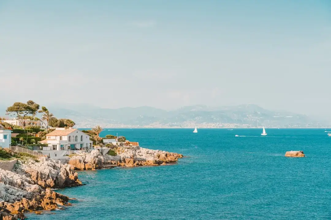 Crystal clear turquoise water of the Mediterranean sea reflecting sunlight on a calm day