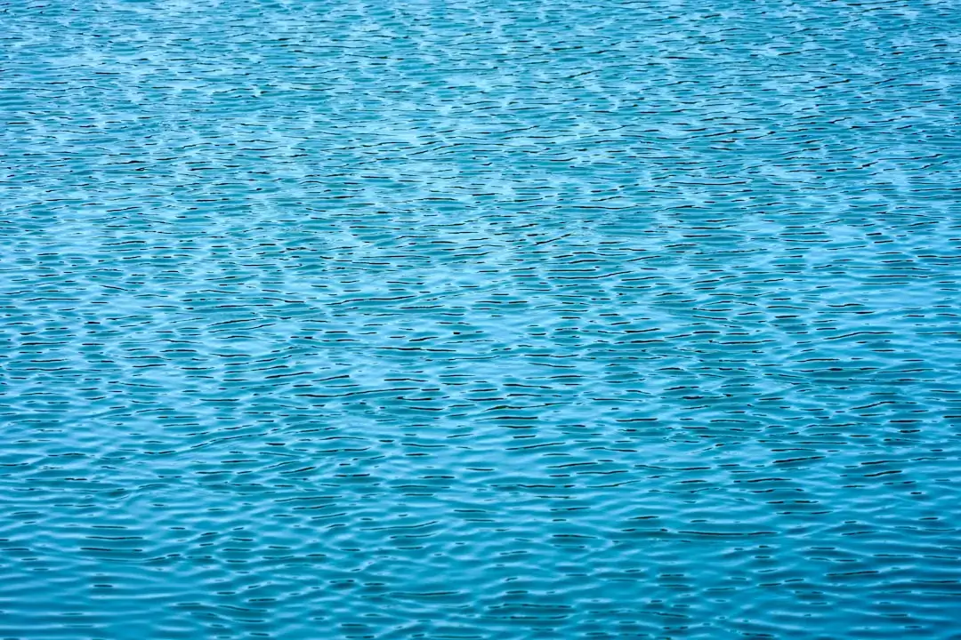 Crystal clear turquoise ocean water over white sand in Zanzibar, Tanzania