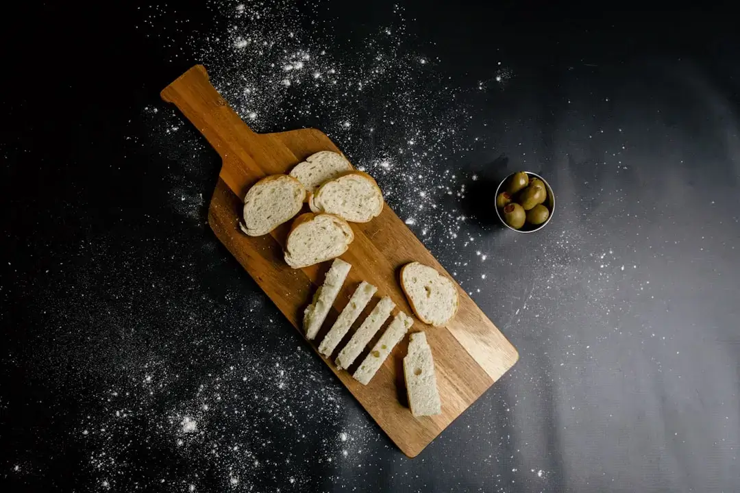 Several pieces of old dry bread placed inside a brown organic bio-waste recycling bin