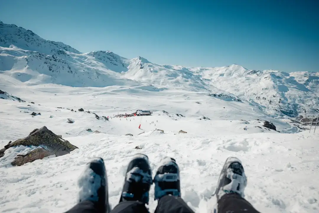 A happy family skiing together on a snowy mountain slope in Poland during winter vacation.
