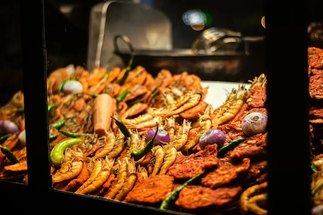An elegant variety of gourmet dishes beautifully arranged on a luxury resort buffet table.
