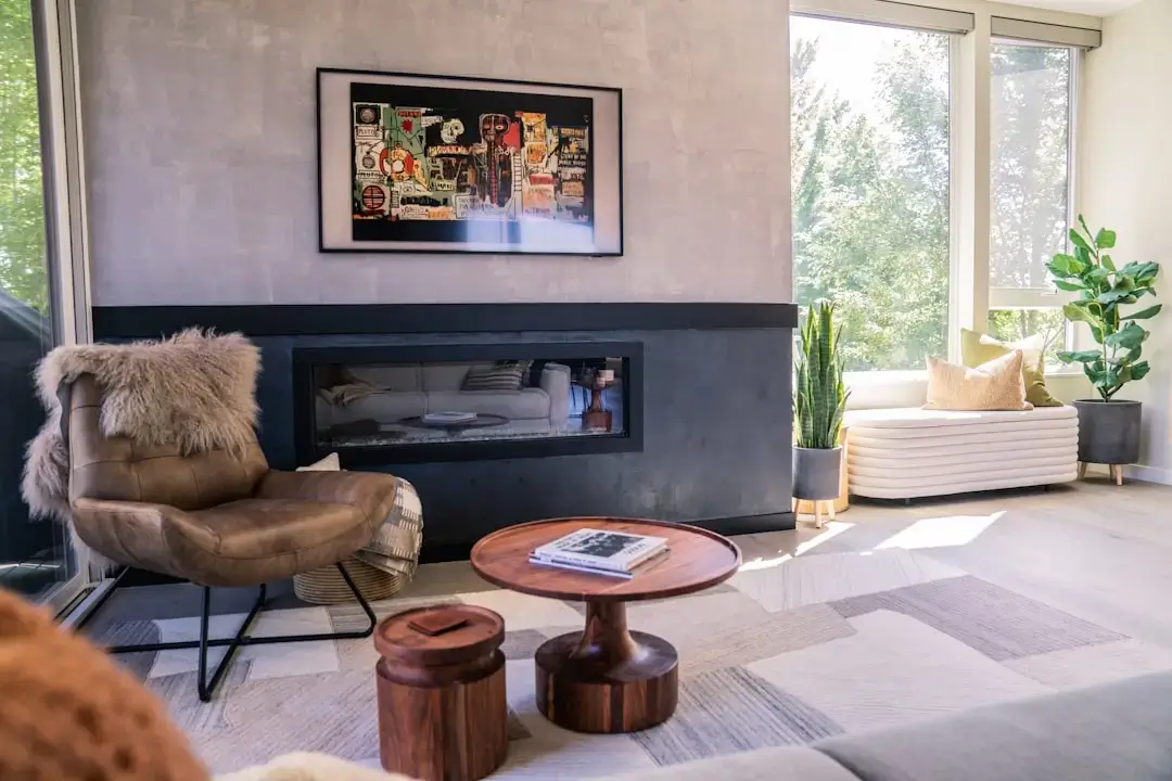 A sleek, modern smart thermostat mounted on a wall in a contemporary home to control the heating system.