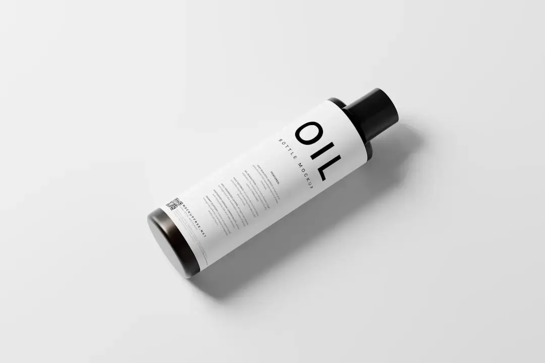 An aesthetic flat lay of natural body scrub in a glass jar alongside a bottle of essential skincare oil on a neutral background.