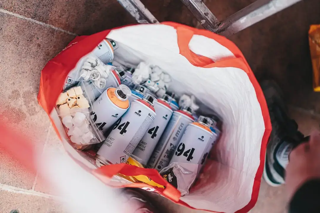 A pile of crushed colorful aluminum soda cans ready for recycling