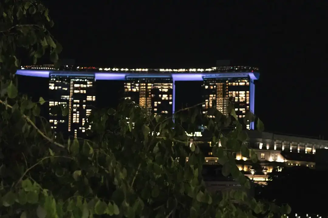 Panoramic view of the modern Singapore skyline with futuristic skyscrapers and financial district architecture at dusk.