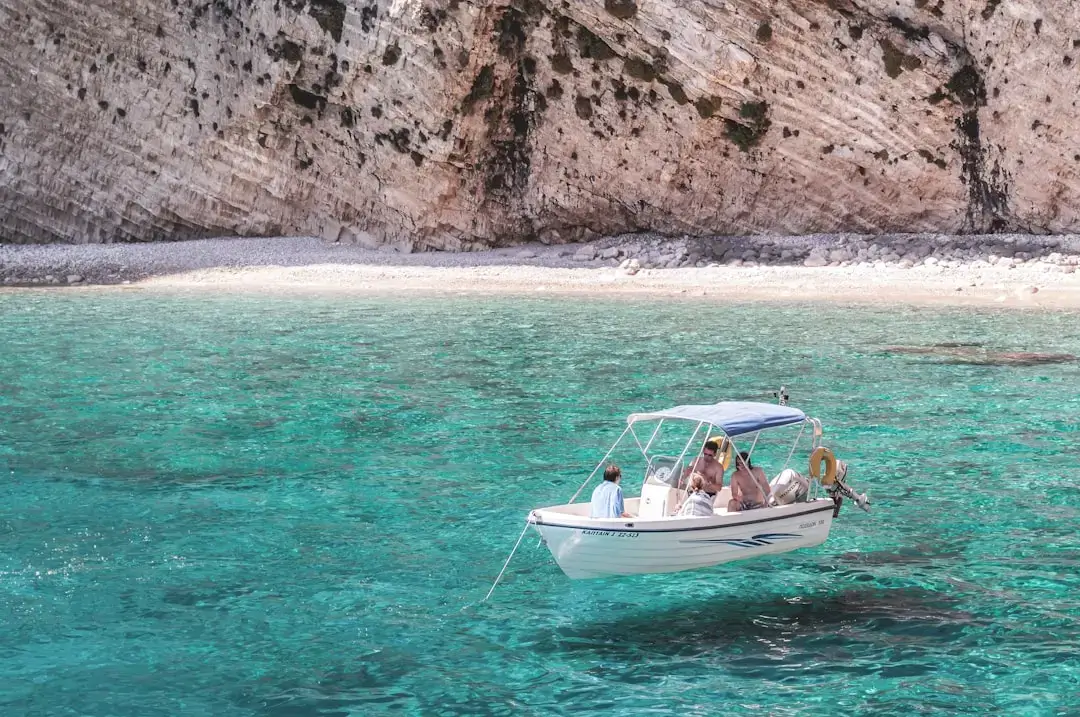 A person snorkeling in vibrant turquoise tropical water exploring the underwater world.