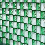 a wall made up of green glass blocks