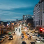 Busy city street with traffic at dusk