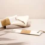 a towel and a bottle of lotion sitting on a table