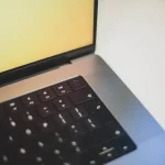 a close up of a laptop computer keyboard