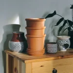 brown clay pot on brown wooden table
