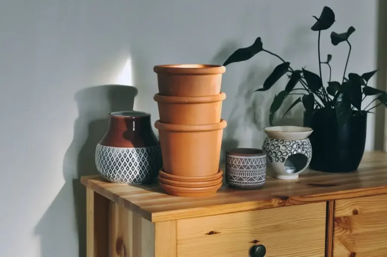 brown clay pot on brown wooden table