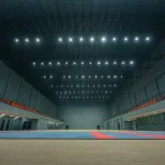 Empty indoor sports arena with spectator seating