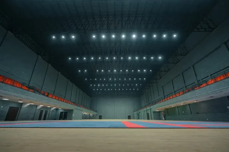 Empty indoor sports arena with spectator seating