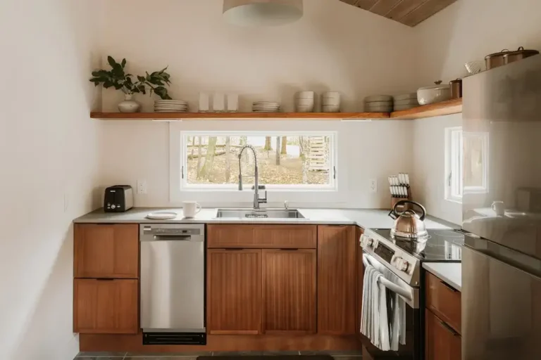 Modern kitchen with wooden cabinets and stainless steel appliances
