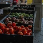 red apples on black plastic crate