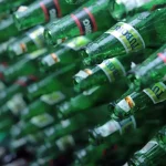 A collection of clean, sorted glass bottles ready for processing at a recycling center.