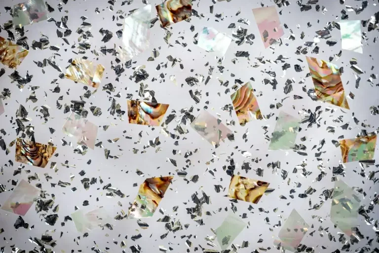 A close-up shot of sustainable bioplastic pellets and eco-friendly raw materials representing green manufacturing.