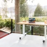 A modern eco-friendly office workspace filled with green plants representing corporate sustainability initiatives.