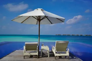 A modern resort restaurant setting representing the concept of an all-inclusive light holiday package with meals and limited drinks.