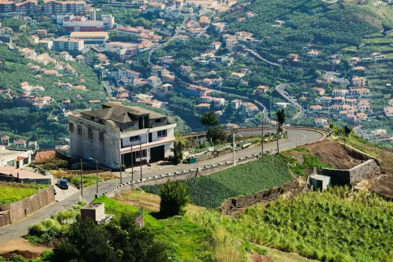 A scenic view of a traditional Portuguese street and historic architecture representing top tourist attractions in Portugal