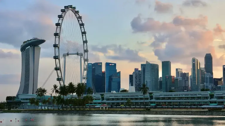 Modern Singapore city skyline featuring Marina Bay Sands and financial district towers representing travel costs.